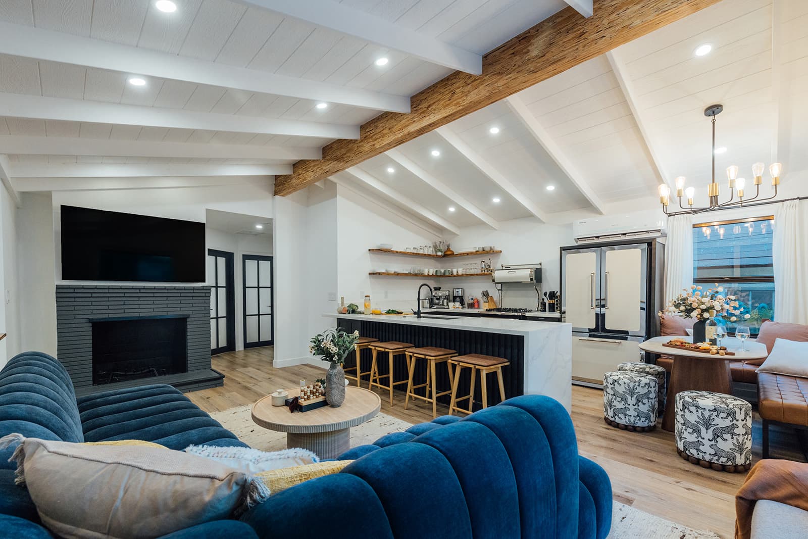 The great room under vaulted, whitewashed beams