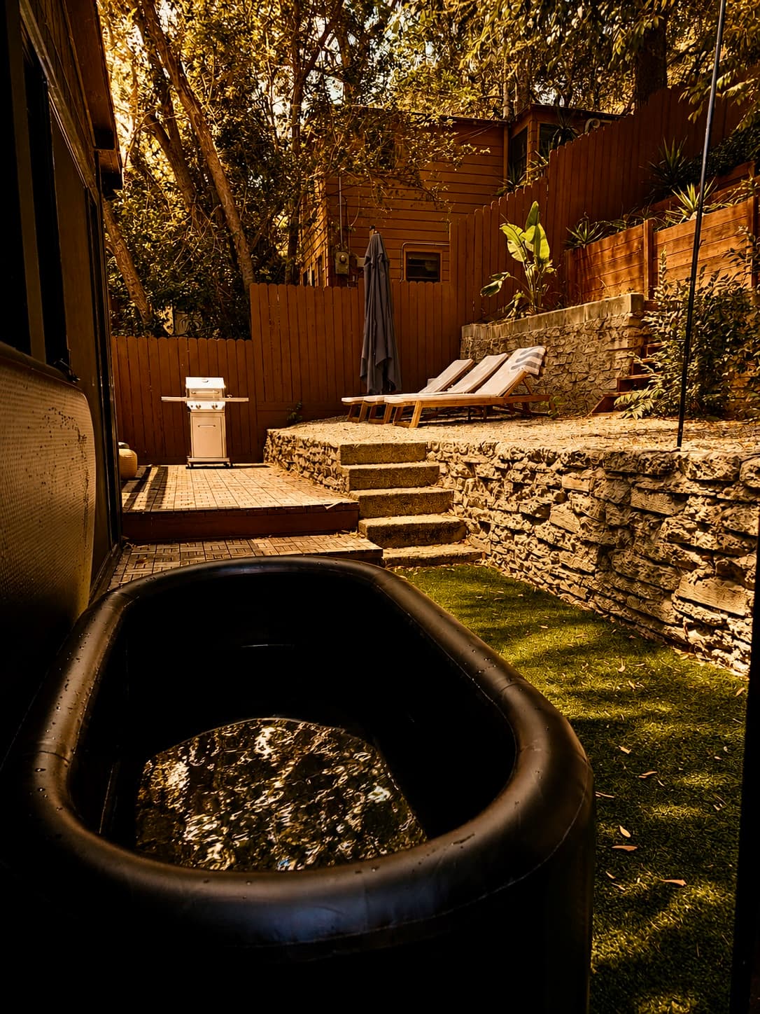 The cold plunge in the garden, a closer view of the water and its surround